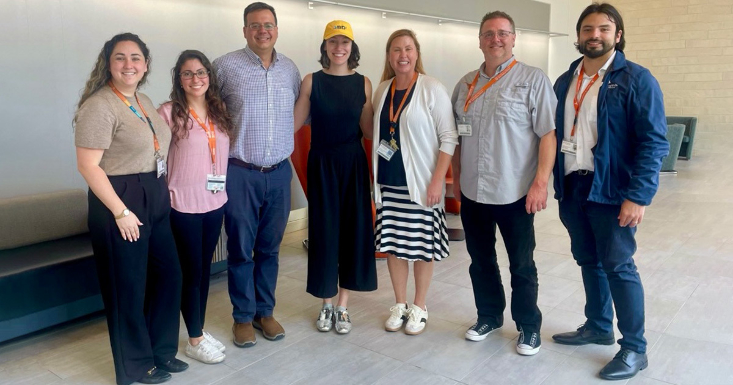 Bipolar care team members smile and stand together for a group photo.