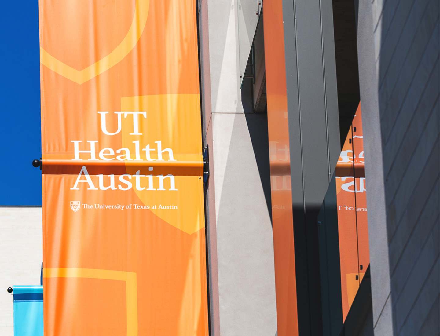 UT Health Austin banners on the Health Transformation Building.