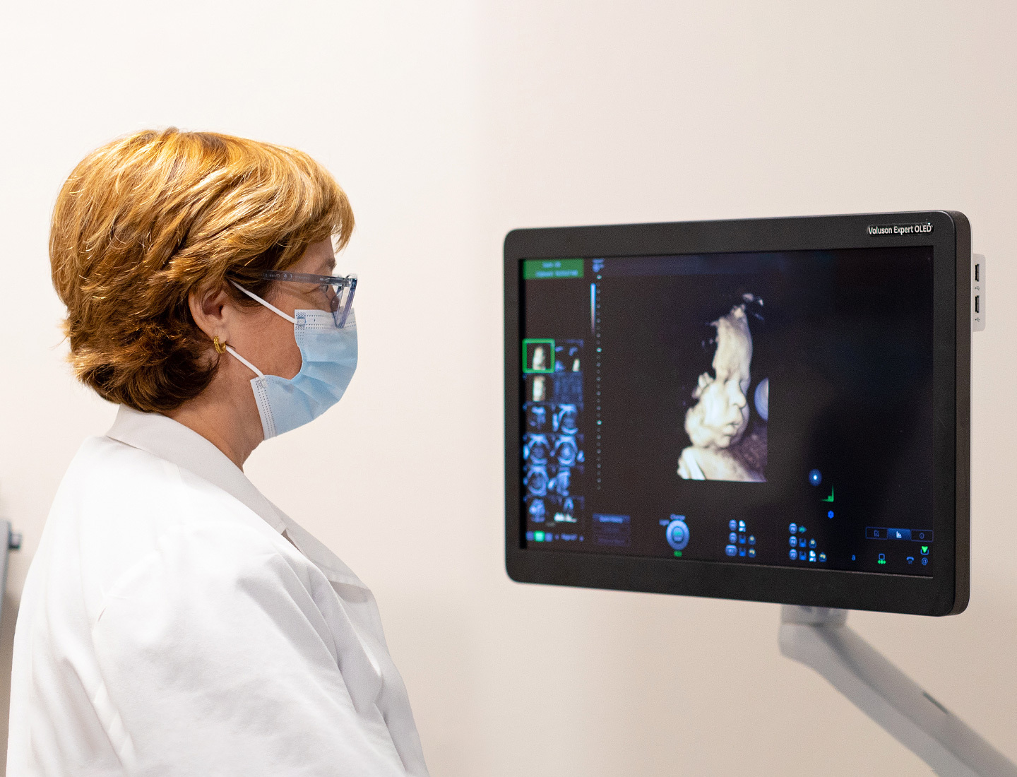 Celeste Sheppard, MD, a maternal fetal medicine specialist, reviews an ultrasound image of a fetus during an exam.