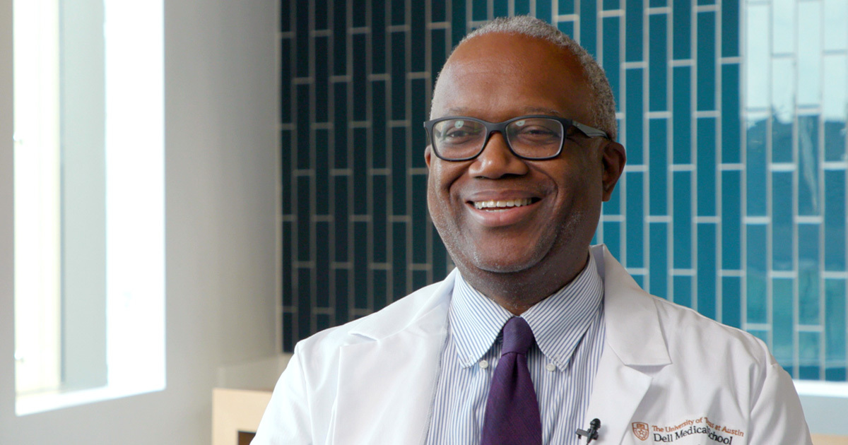Dr. Kevin Hackshaw, rheumatologist, is featured during an interview, sitting in front of a teal tiled wall.