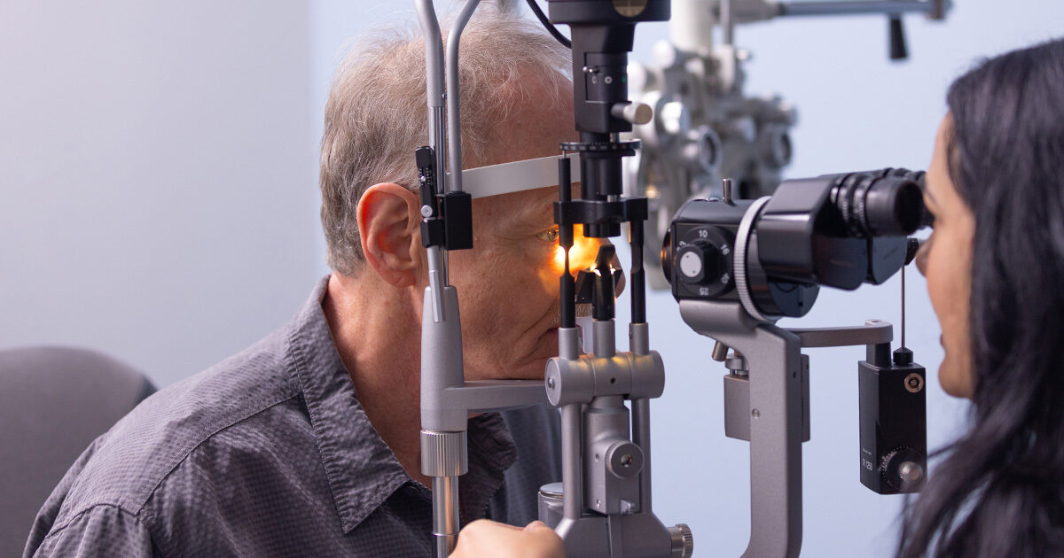 Ophthalmologist Eileen Bowden, MD, examining a patient's eyes.
